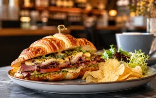 Smoked Beef Croissant Sandwich premium dengan croissant flaky, smoked beef, cheese, sayuran segar, dan sauce untuk menu cafe.